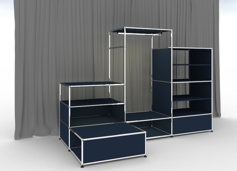 Stahlblaue USM Haller Garderobe mit Beleuchtung und Regalen vor grauem Hintergrund.
