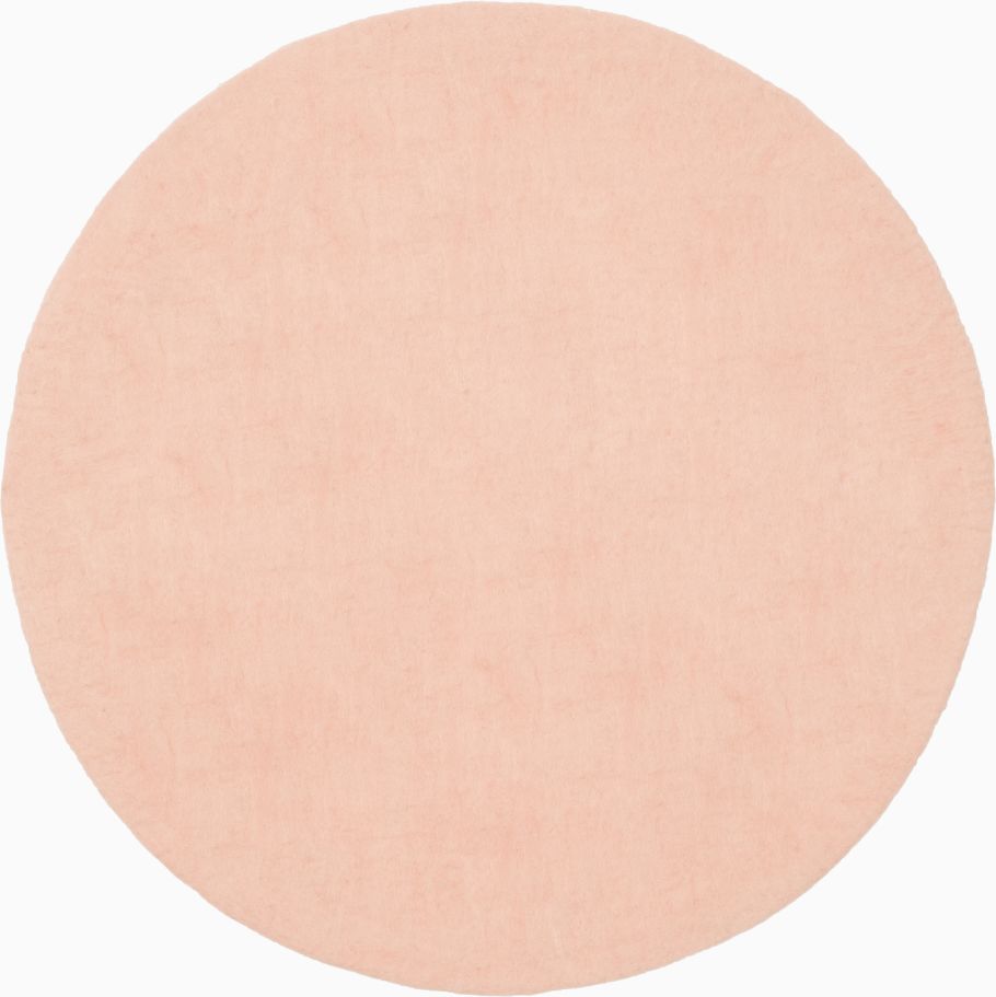 Runder, rosa Filzteppich "Merle" von myfelt, Durchmesser 160 cm. Moderner Teppich aus Filz.