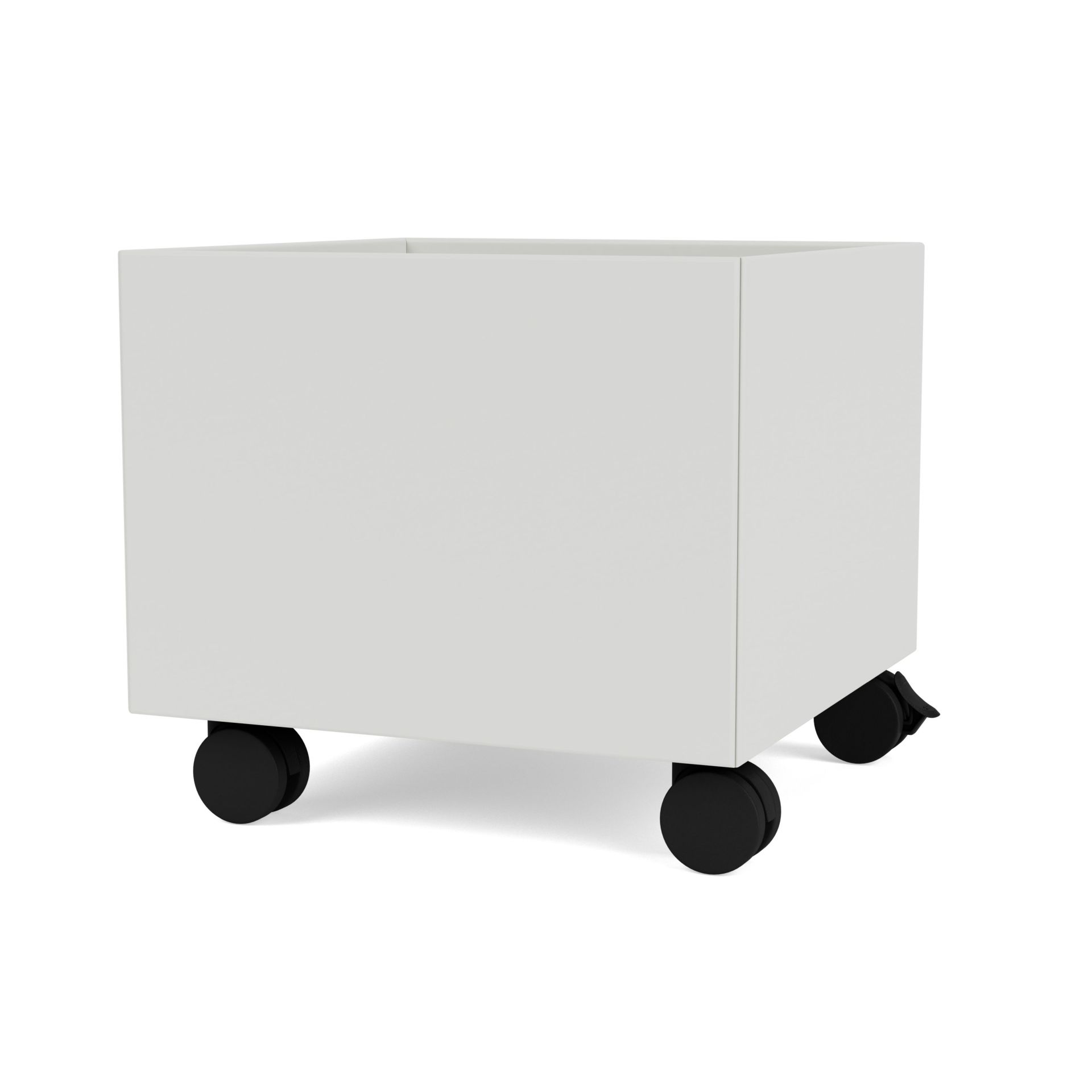 Nordische Mini Play Aufbewahrungsbox in Montana-Optik, weiße Spielzeugkiste mit schwarzen Rollen für Kinderzimmer.